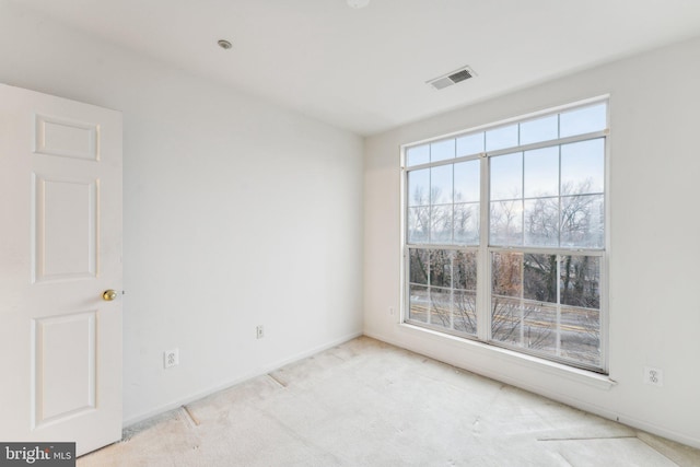 empty room with light colored carpet