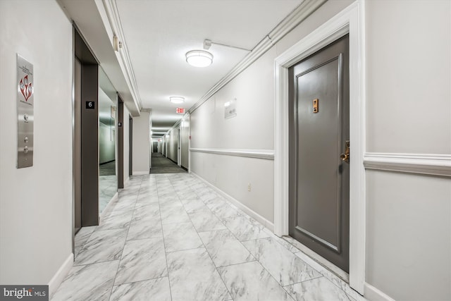 hall featuring ornamental molding