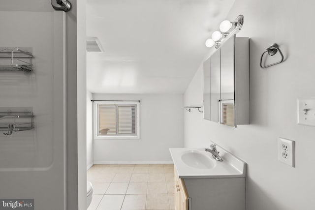 bathroom with tile patterned floors, vanity, and toilet