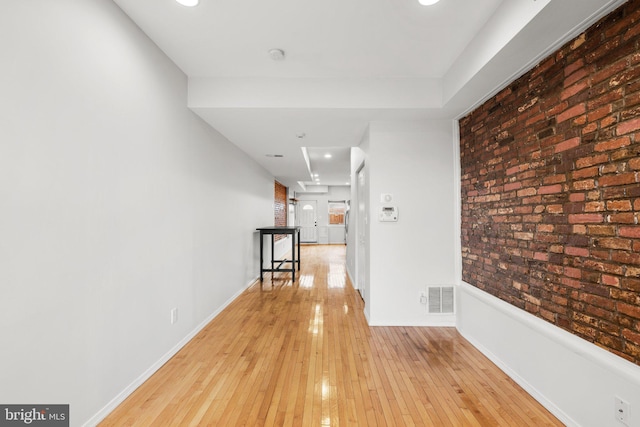 corridor featuring light hardwood / wood-style floors