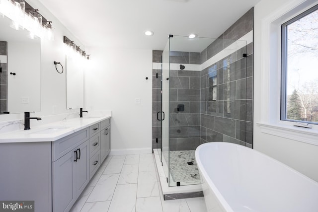 bathroom with shower with separate bathtub and vanity