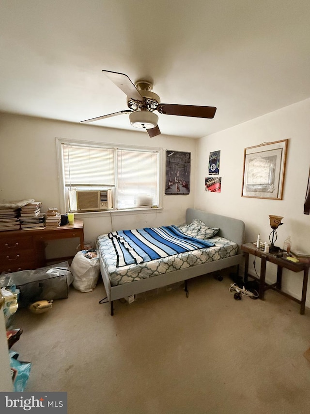 carpeted bedroom with ceiling fan and cooling unit