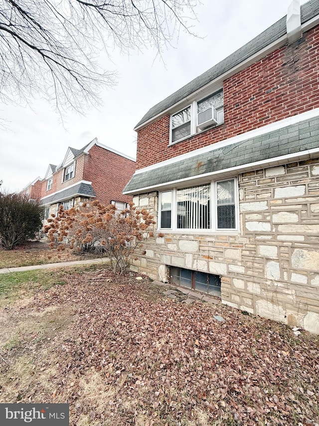 view of side of property with cooling unit