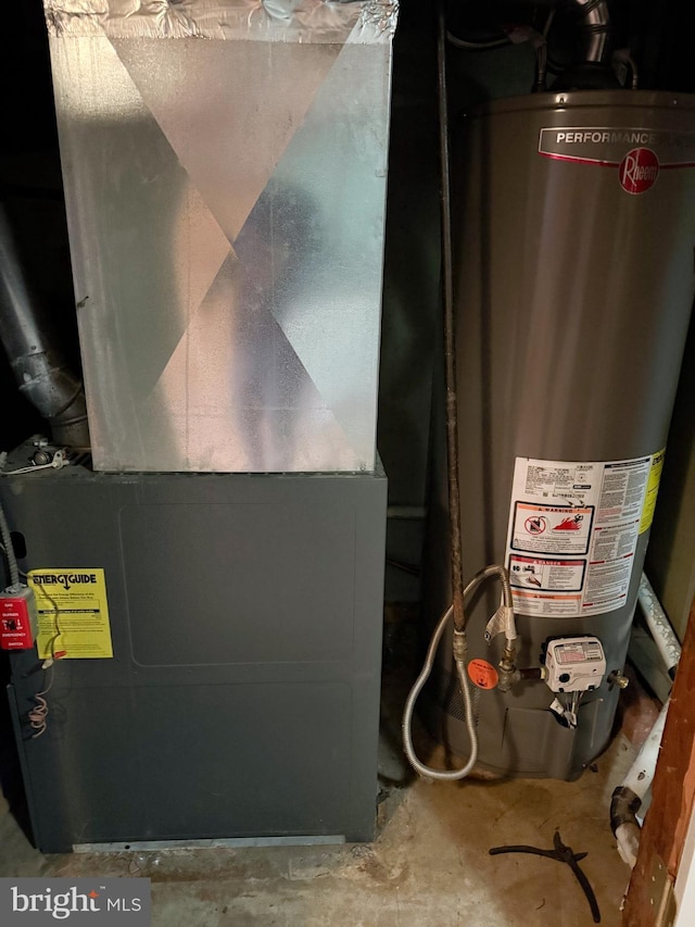 utility room featuring heating unit and water heater