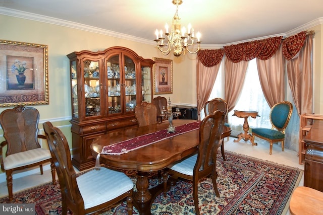 carpeted dining space with ornamental molding and an inviting chandelier