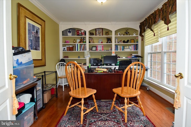 office area featuring crown molding and dark hardwood / wood-style flooring