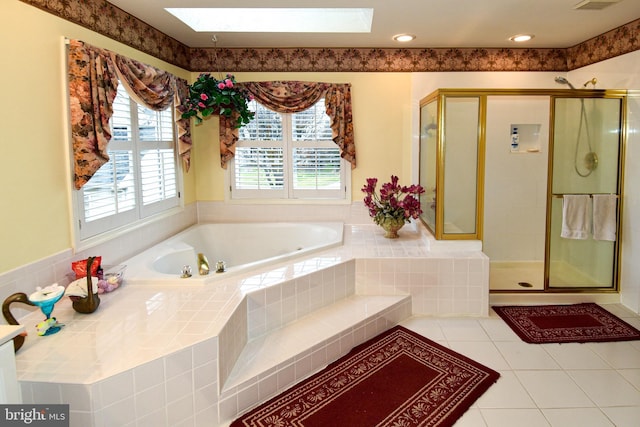 bathroom with tile patterned flooring and independent shower and bath