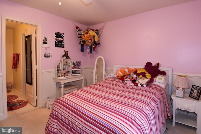 bedroom with ceiling fan and light carpet