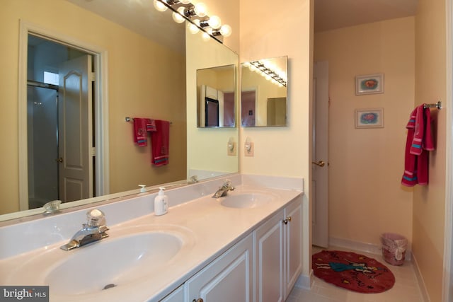 bathroom with tile patterned flooring and vanity