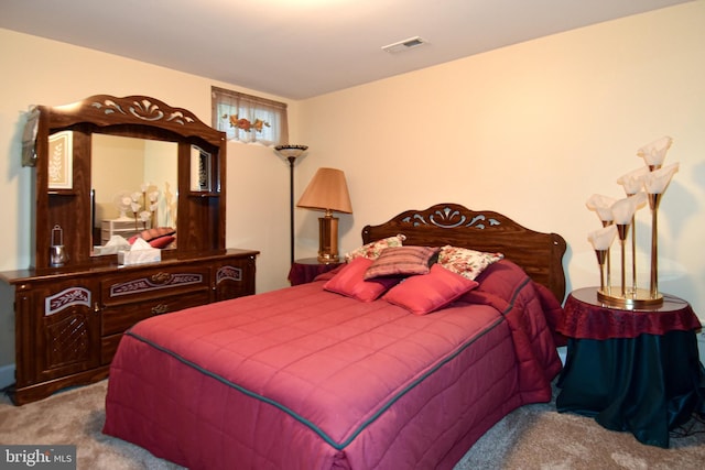 bedroom featuring light colored carpet