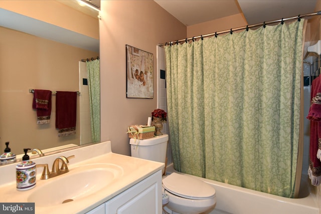 full bathroom featuring shower / bathtub combination with curtain, vanity, and toilet