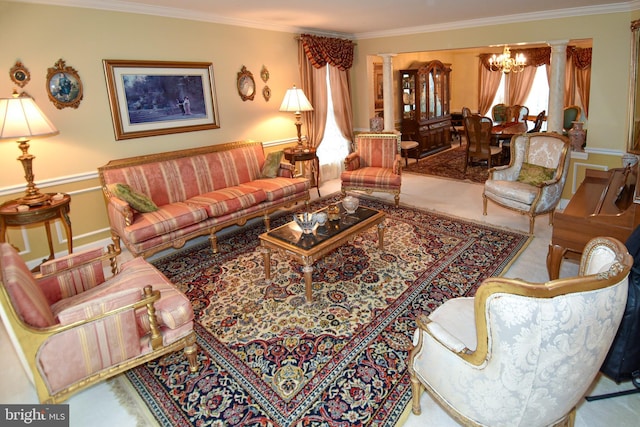 living room with plenty of natural light, ornate columns, and ornamental molding