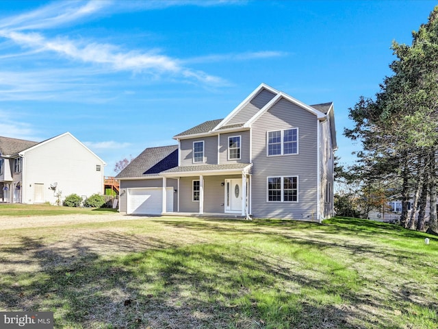 view of front of home featuring a garage, covered porch, and a front lawn