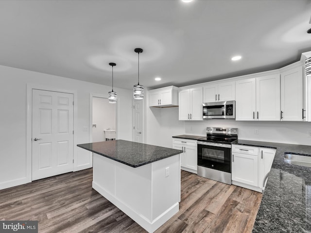 kitchen featuring white cabinetry, dark wood-type flooring, and appliances with stainless steel finishes