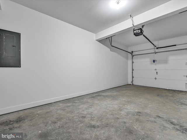 garage featuring electric panel and a garage door opener