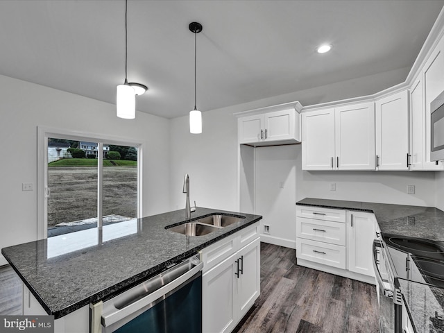 kitchen featuring pendant lighting, white cabinetry, stainless steel dishwasher, and sink