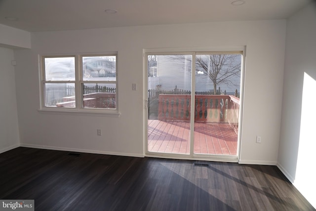 empty room with dark hardwood / wood-style floors