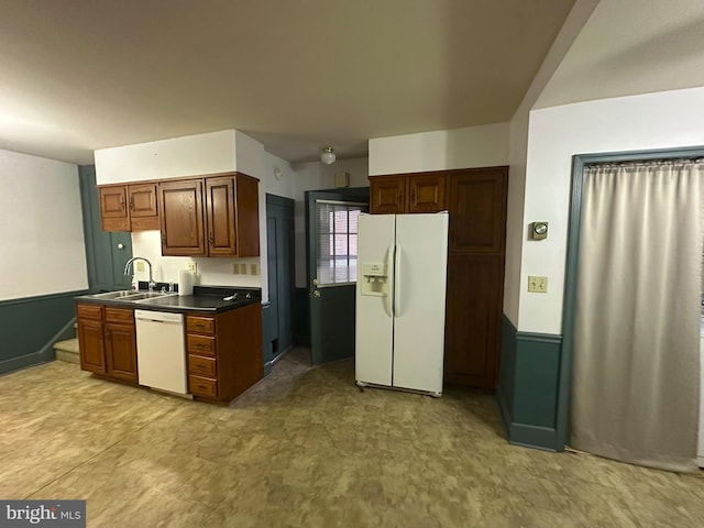 kitchen with sink and white appliances