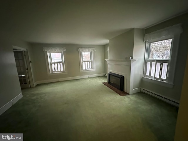 unfurnished living room featuring carpet and a baseboard radiator