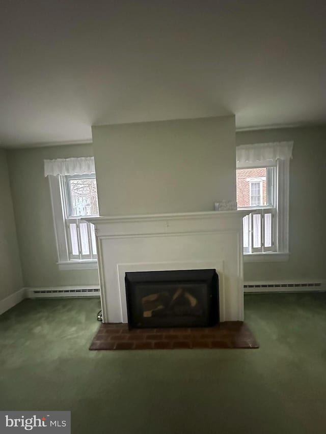 details with carpet flooring and a baseboard heating unit