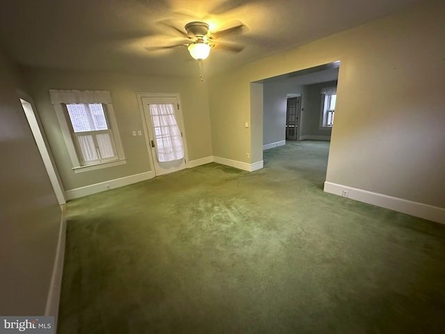 carpeted empty room with ceiling fan