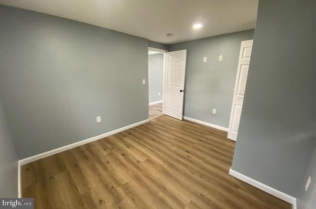 unfurnished bedroom with wood-type flooring