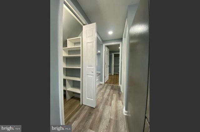 corridor featuring light hardwood / wood-style flooring