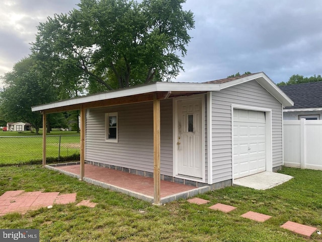 exterior space featuring a yard and a garage