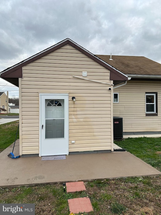 rear view of property featuring cooling unit