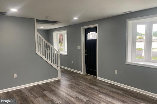 entrance foyer with dark hardwood / wood-style floors