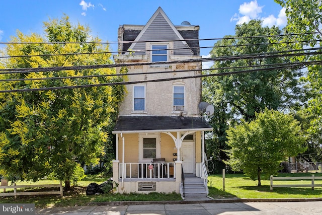 view of front of home featuring a porch and a front yard