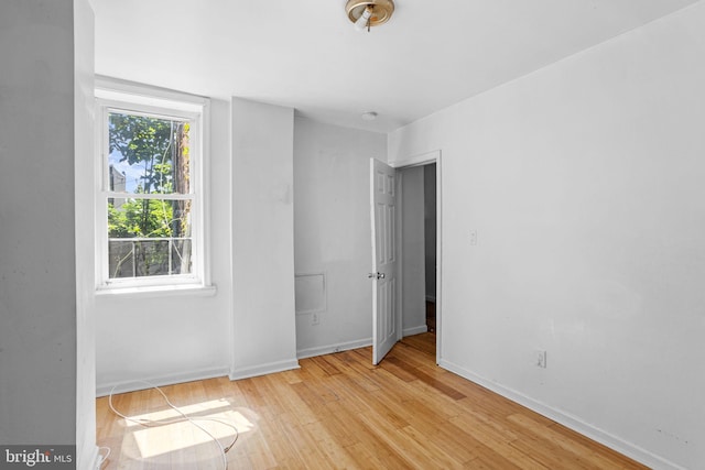 empty room with light wood-type flooring