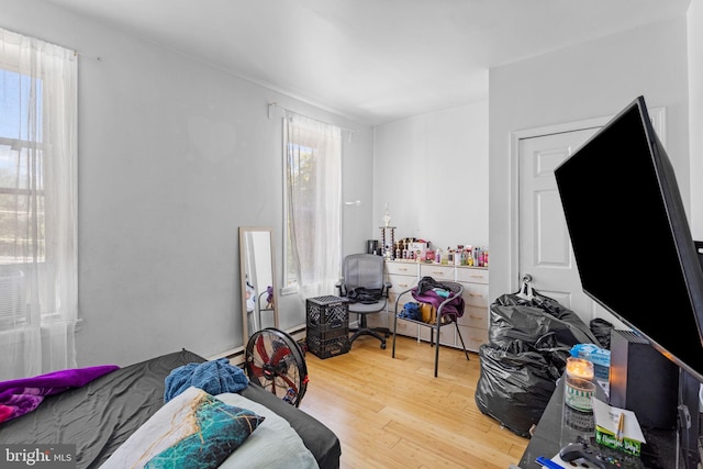 bedroom with hardwood / wood-style floors