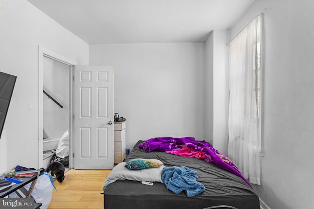 bedroom with wood-type flooring