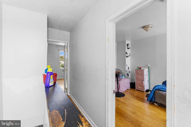 corridor featuring hardwood / wood-style floors