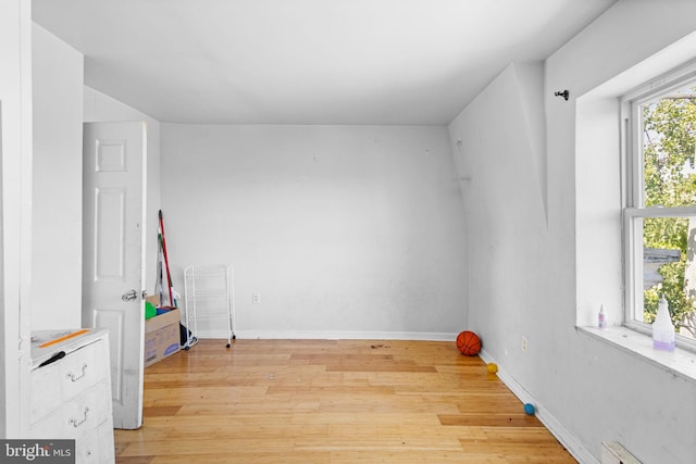 spare room with light wood-type flooring and baseboard heating