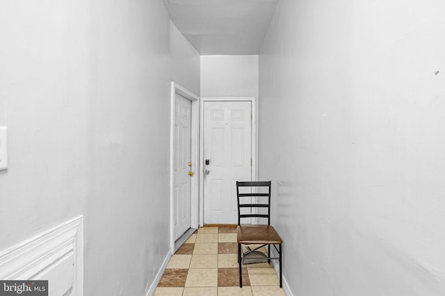 corridor with light tile patterned floors