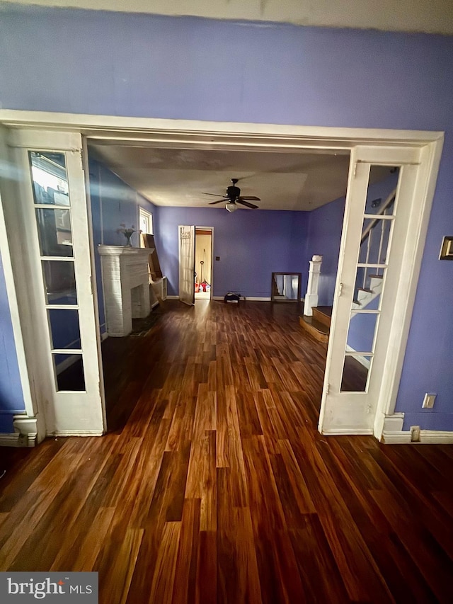 corridor featuring dark hardwood / wood-style flooring