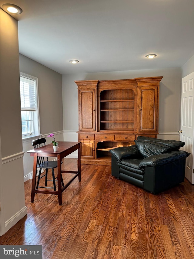 living room featuring dark wood-type flooring