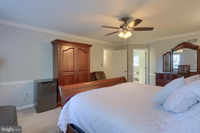 bedroom with light carpet, ensuite bath, ceiling fan, and ornamental molding