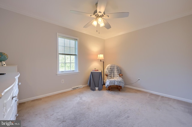 unfurnished room featuring light carpet, ceiling fan, and crown molding