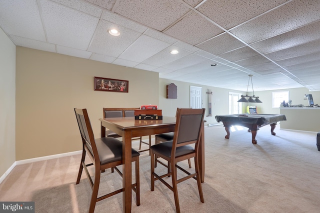 dining space featuring a drop ceiling, carpet floors, and billiards