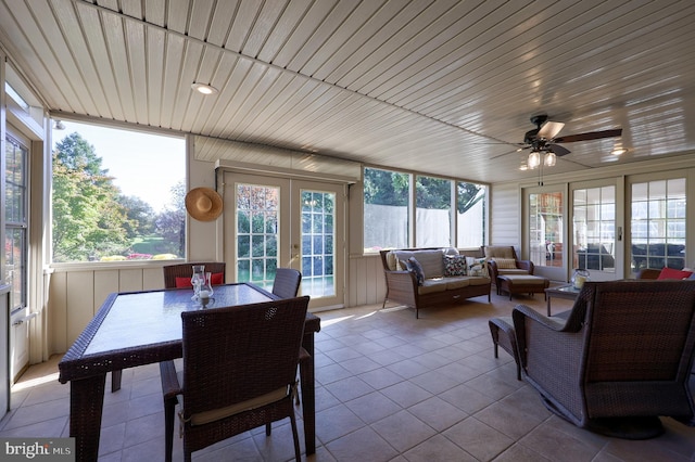 sunroom with french doors, ceiling fan, and wood ceiling