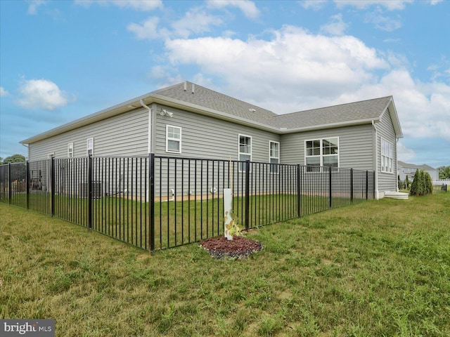 view of home's exterior featuring a yard