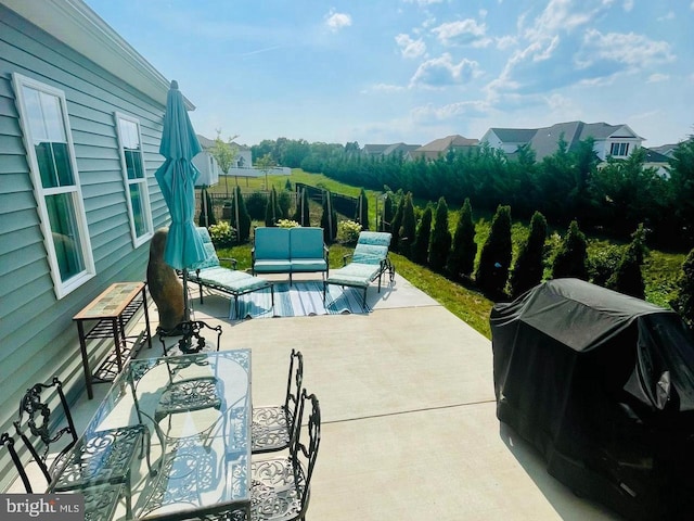 view of pool featuring an outdoor living space, a grill, and a patio