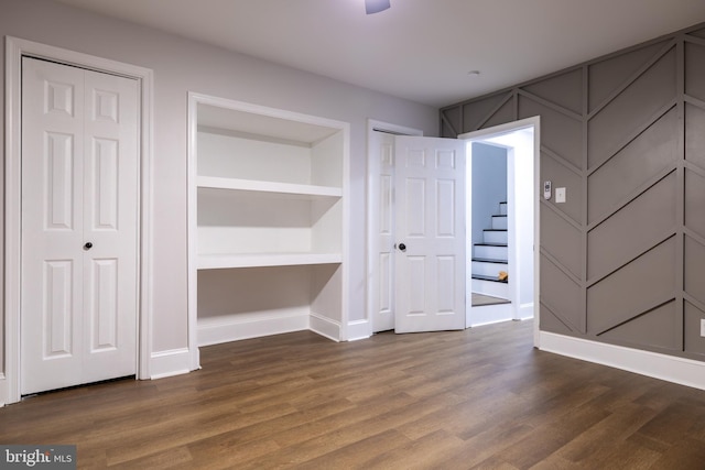 interior space featuring two closets and hardwood / wood-style flooring