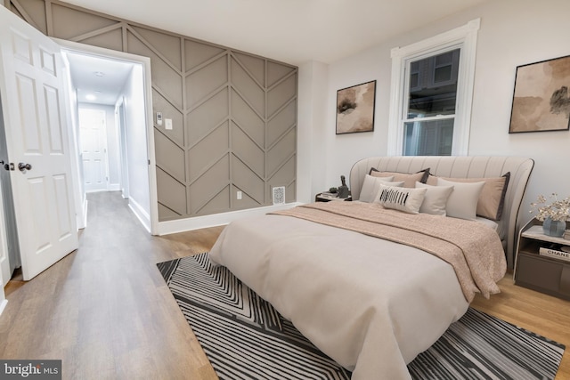 bedroom featuring hardwood / wood-style flooring