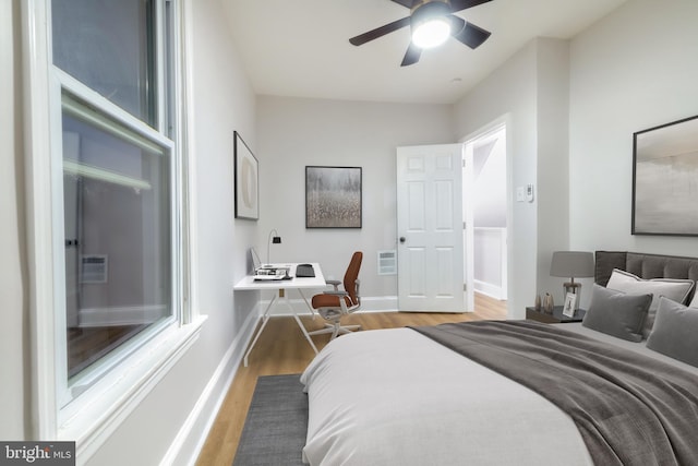 bedroom featuring hardwood / wood-style flooring and ceiling fan