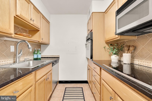 kitchen with backsplash, sink, black appliances, light brown cabinets, and light tile patterned flooring