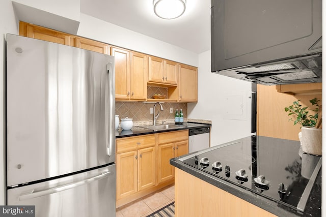 kitchen featuring sink, tasteful backsplash, light brown cabinetry, light tile patterned flooring, and appliances with stainless steel finishes